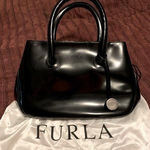 Black leather Furla purse.